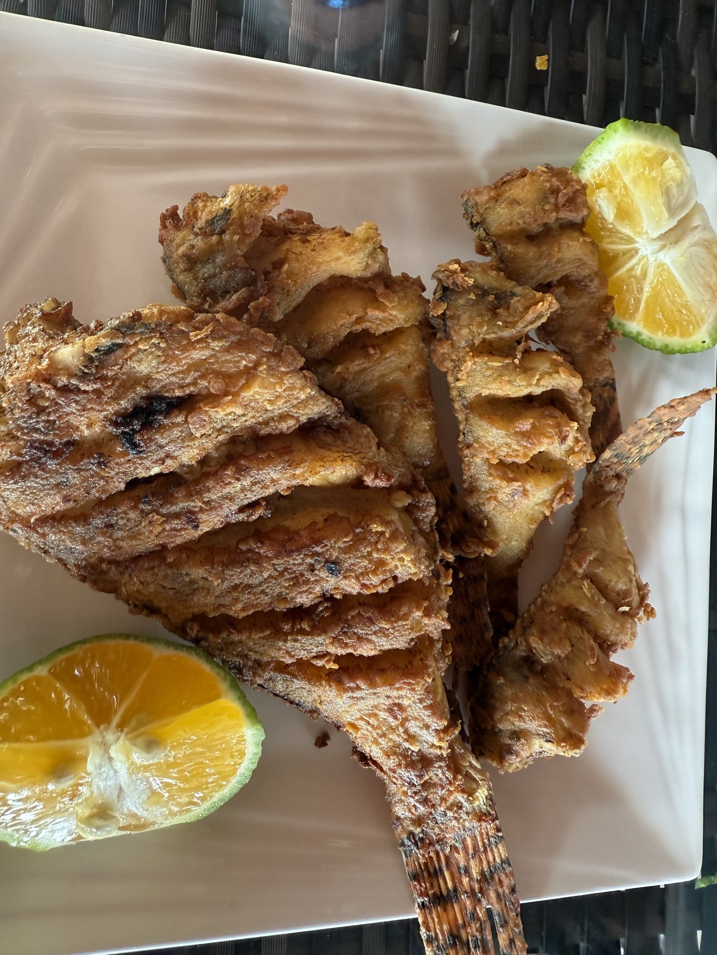 Whole fried lionfish, Panama-style, served with lime